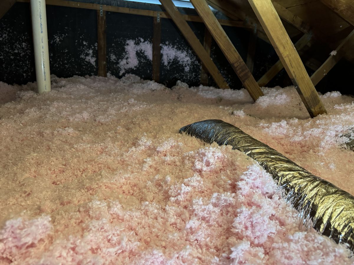 Blown-in attic insulation and flex ductwork in a San Antonio home