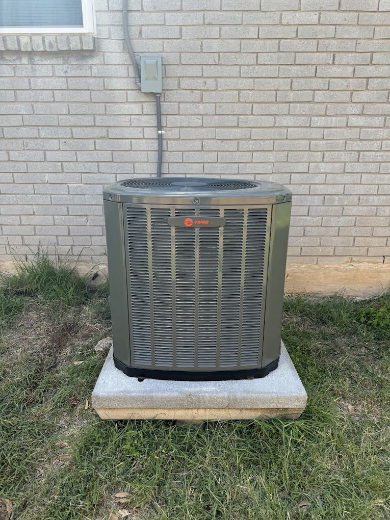 New Trane air conditioner installed on a fresh pad at a San Antonio home